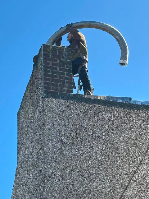Flexible stainless steel chimney liner installation